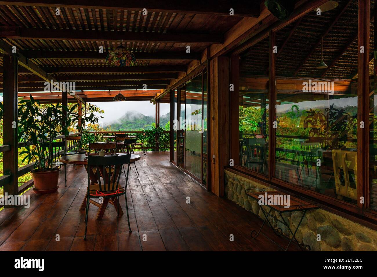 Tables in a restaurant with cloud forest view in Mindo, Ecuador Stock Photo Alamy