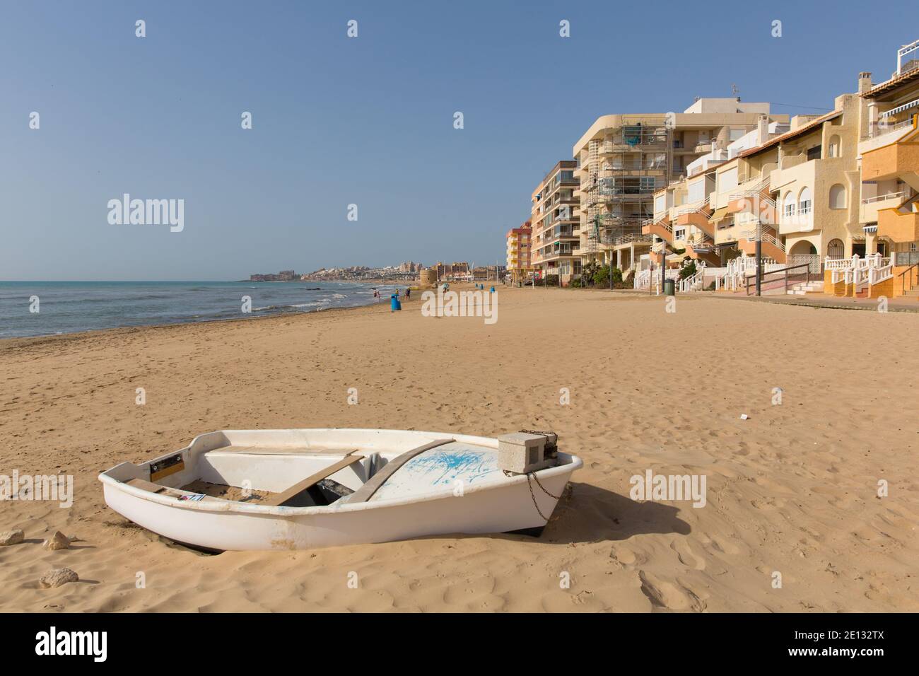 Torre la Mata Spain beautiful sandy beach with whiteboat Stock Photo