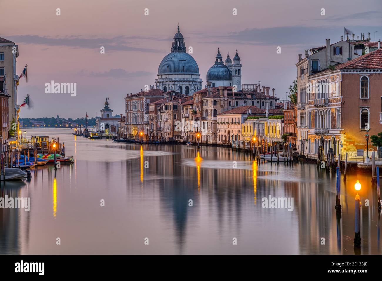 The Grand Canal and the Basilica Di Santa Maria Della Salute in Venice early in the morning Stock Photo