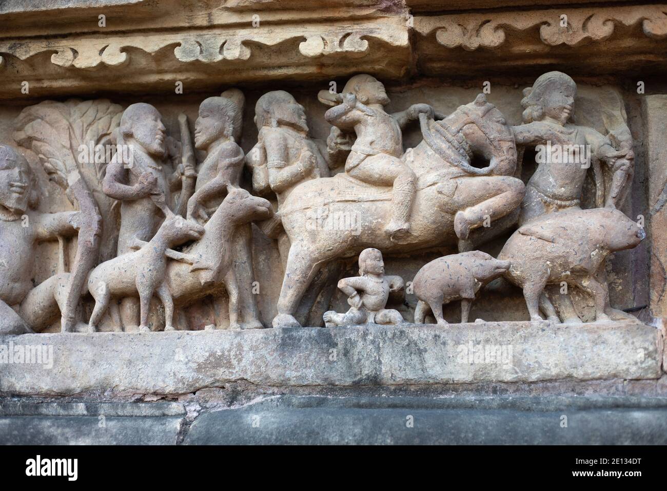 Sculpture of people hunting, Khajuraho, Madhya Pradesh, India Stock Photo