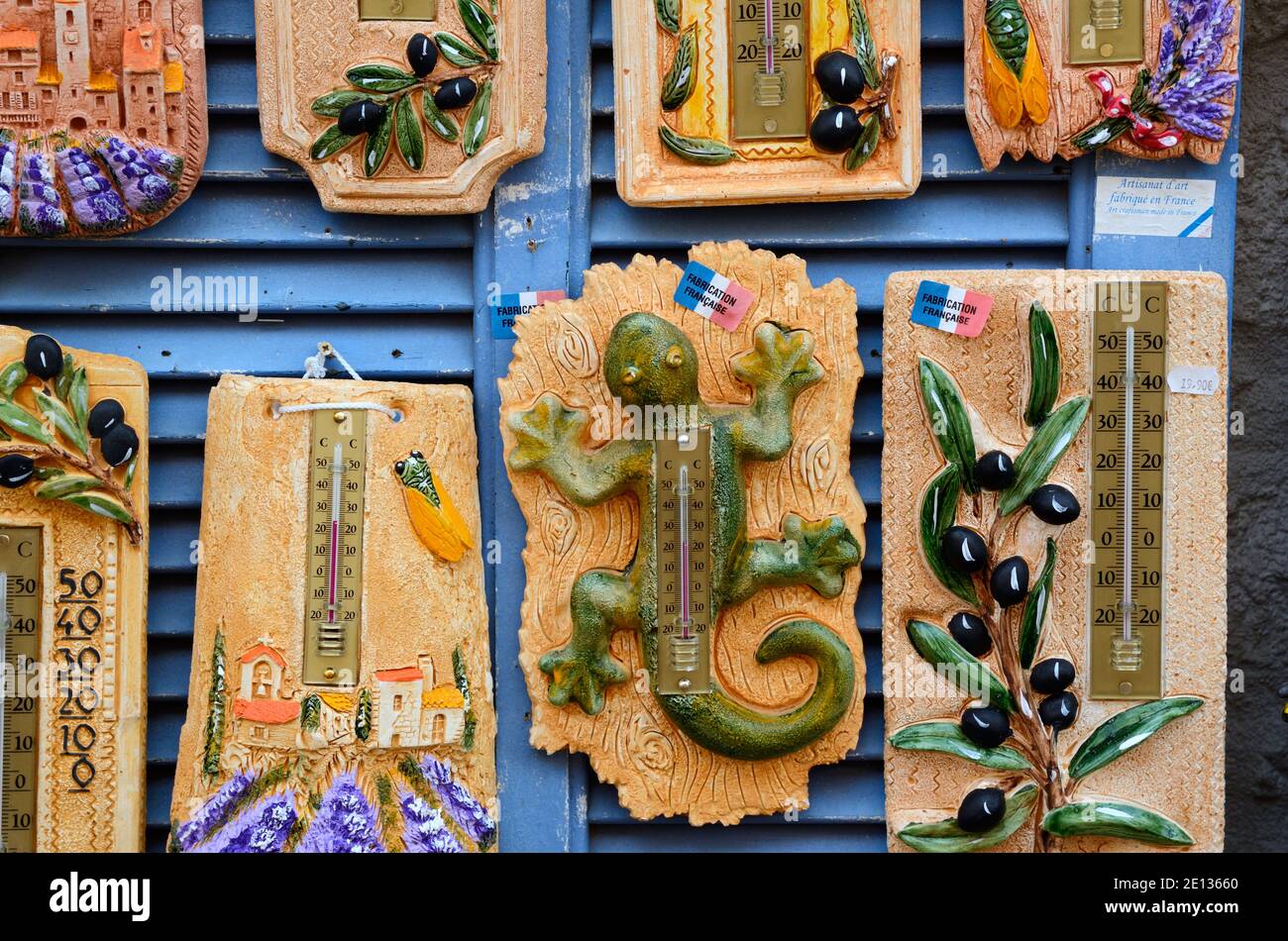 Kitsch Souvenir Thermometers with Provence Themes incl. Olives Lavender & Lizards or Geckos in Gift Shop or Stall Le Castellet Provence France Stock Photo