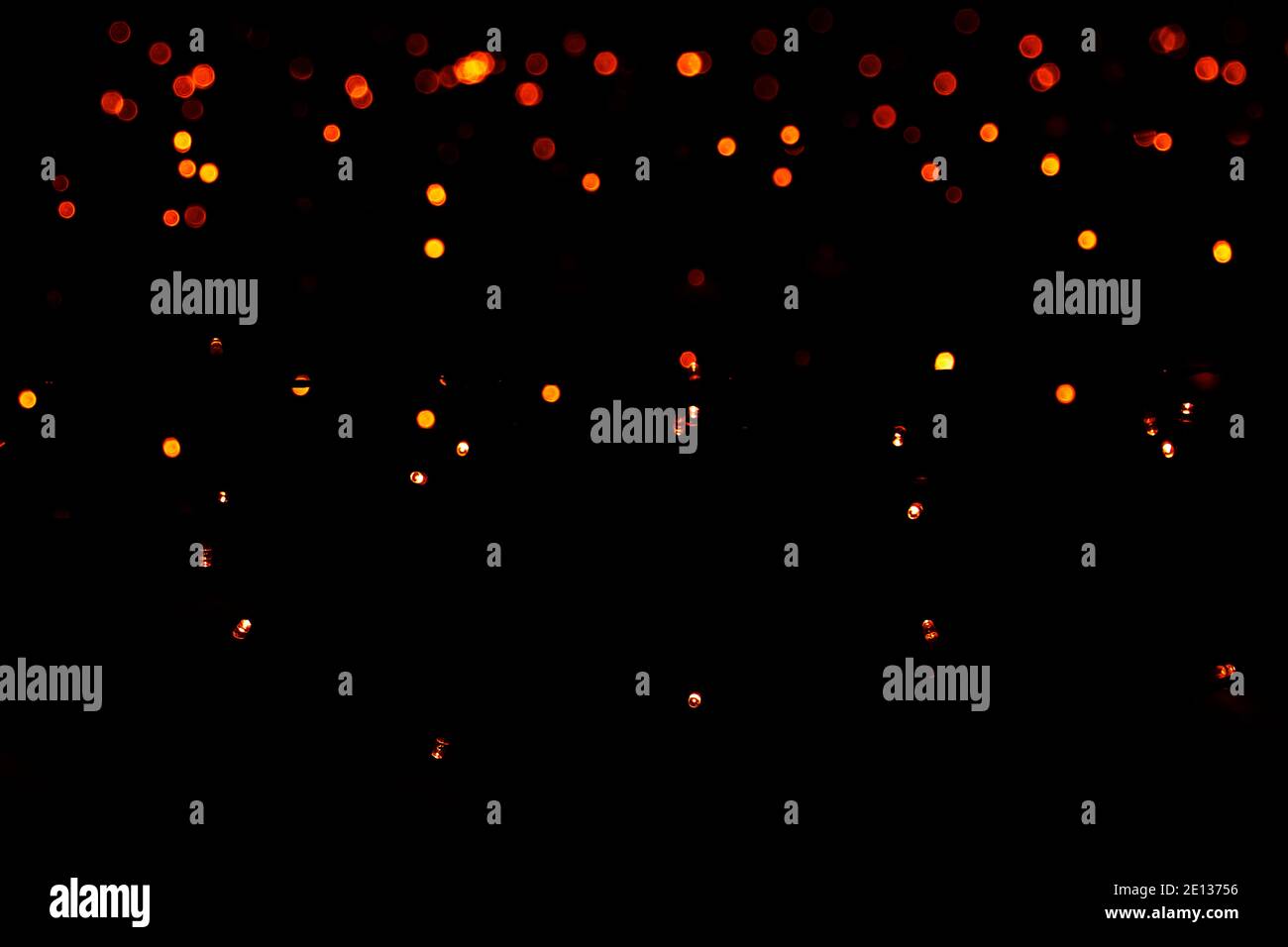 light dots black background. blurred abstract pattern, bokeh background. Stock Photo
