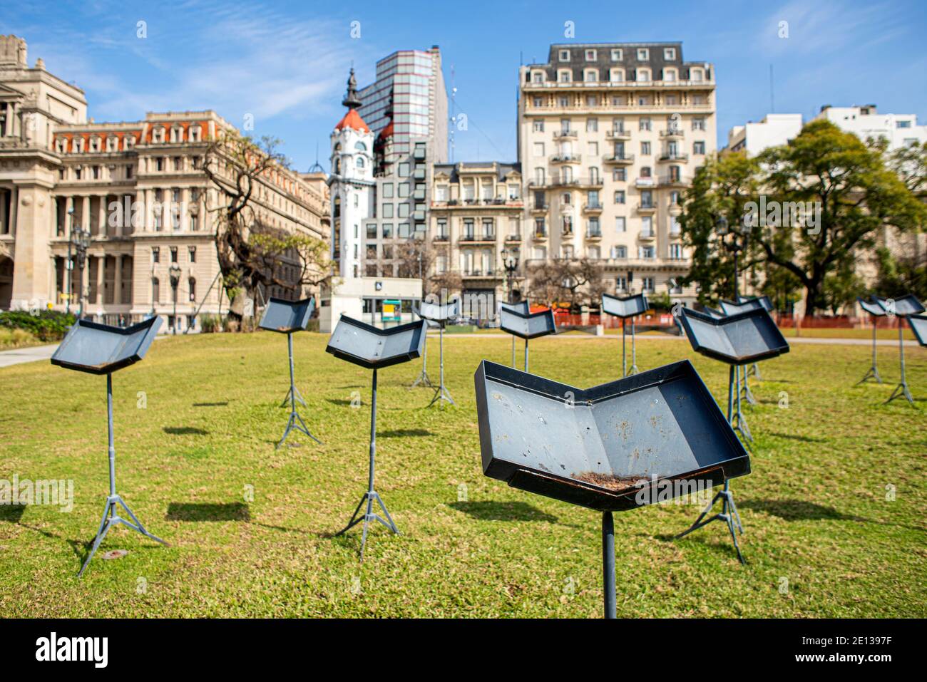 Music stands in a park in Buenos Aires, Argentina. In the background you can see some typical buildings Stock Photo