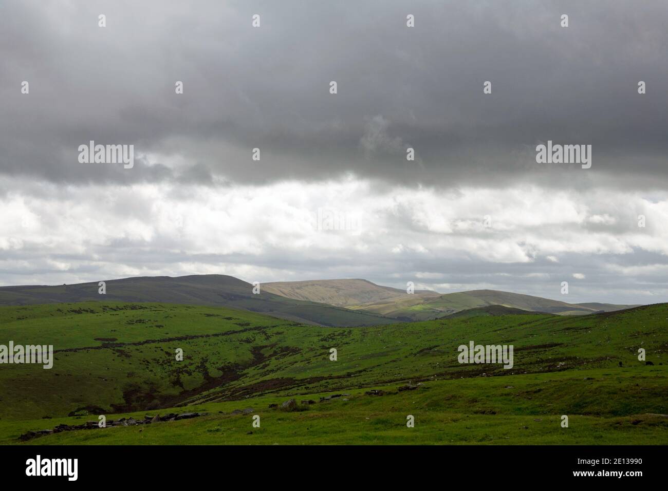Summer storm clouds passing above the summit of Shining Tor viewed from Sponds Hill Lyme Handley Cheshire Stock Photo
