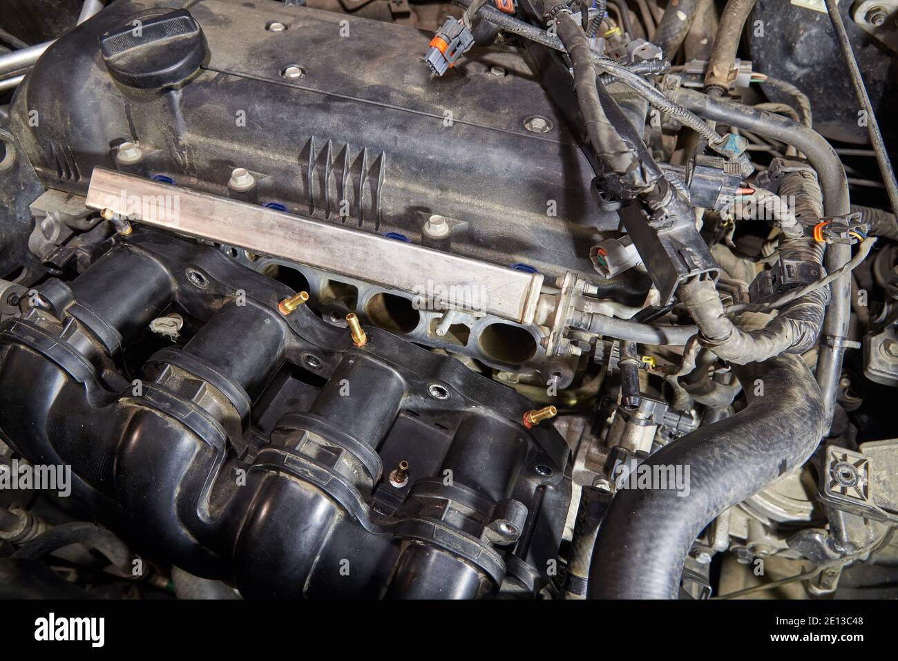 Car engine repair, intake manifold, connection of LPG injectors Stock Photo Alamy