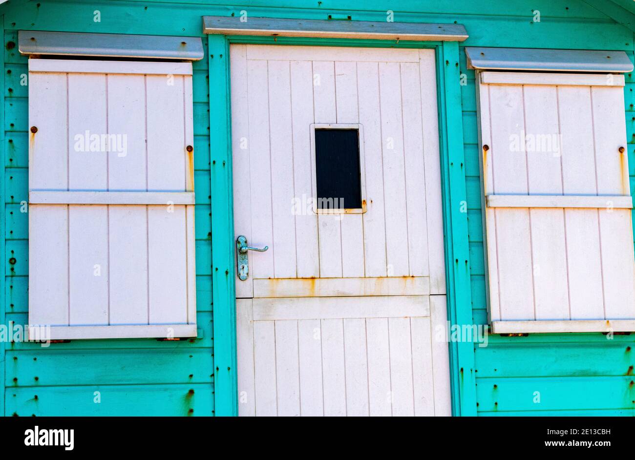 Colourful Detail of a Bright Green and White Beach Hut on Westward Ho Seafront Overlooking the Beach and Torridge Estuary. Westward Ho!, Devon, Englan Stock Photo