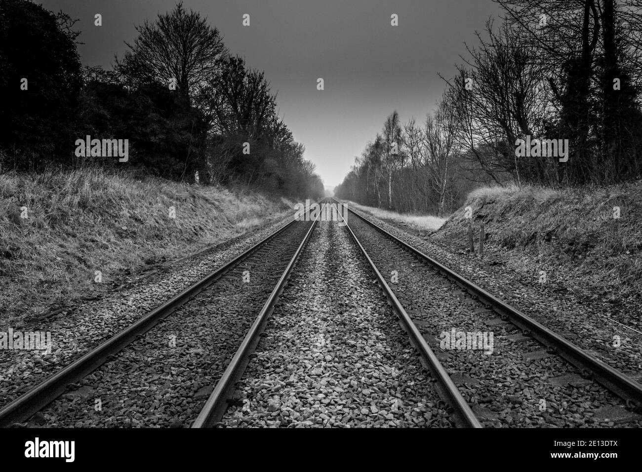 Twin rail track going off into the horizon Stock Photo Alamy
