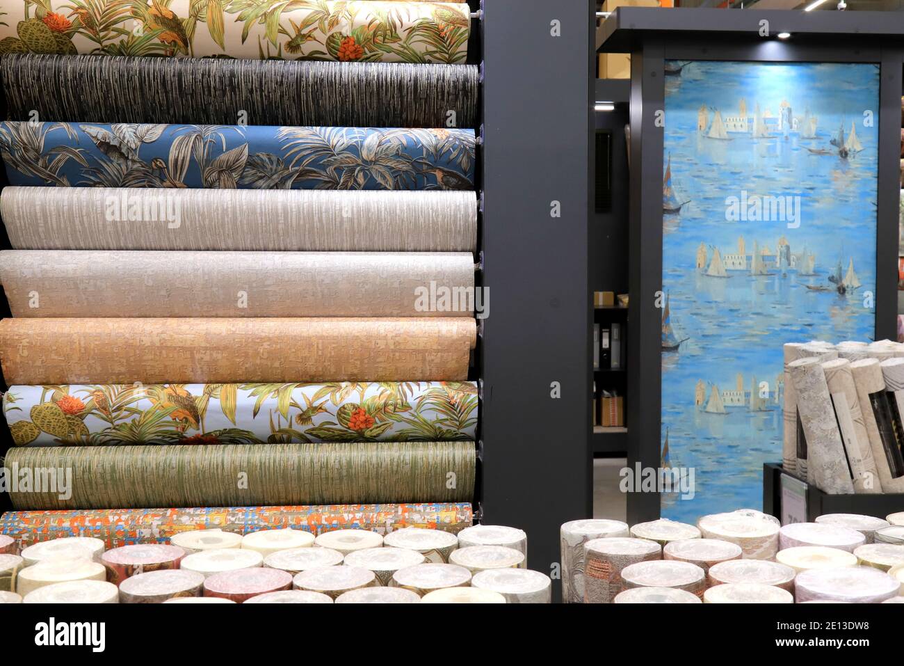 Rolls of vinyl wallpaper in a building supermarket, store, market