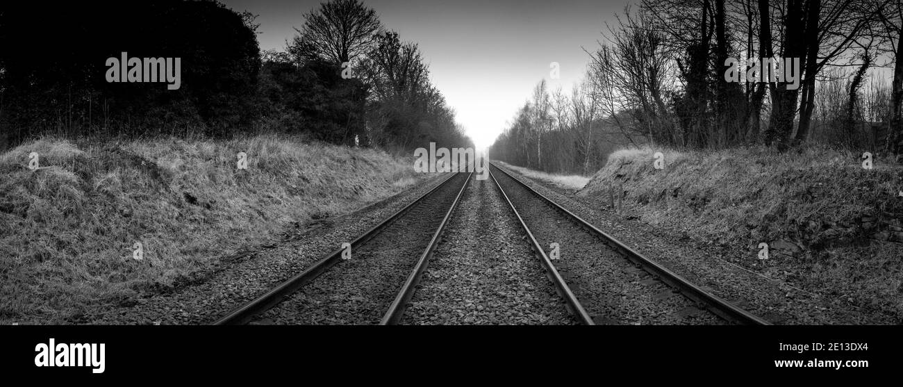 Twin rail track going off into the horizon. Stock Photo
