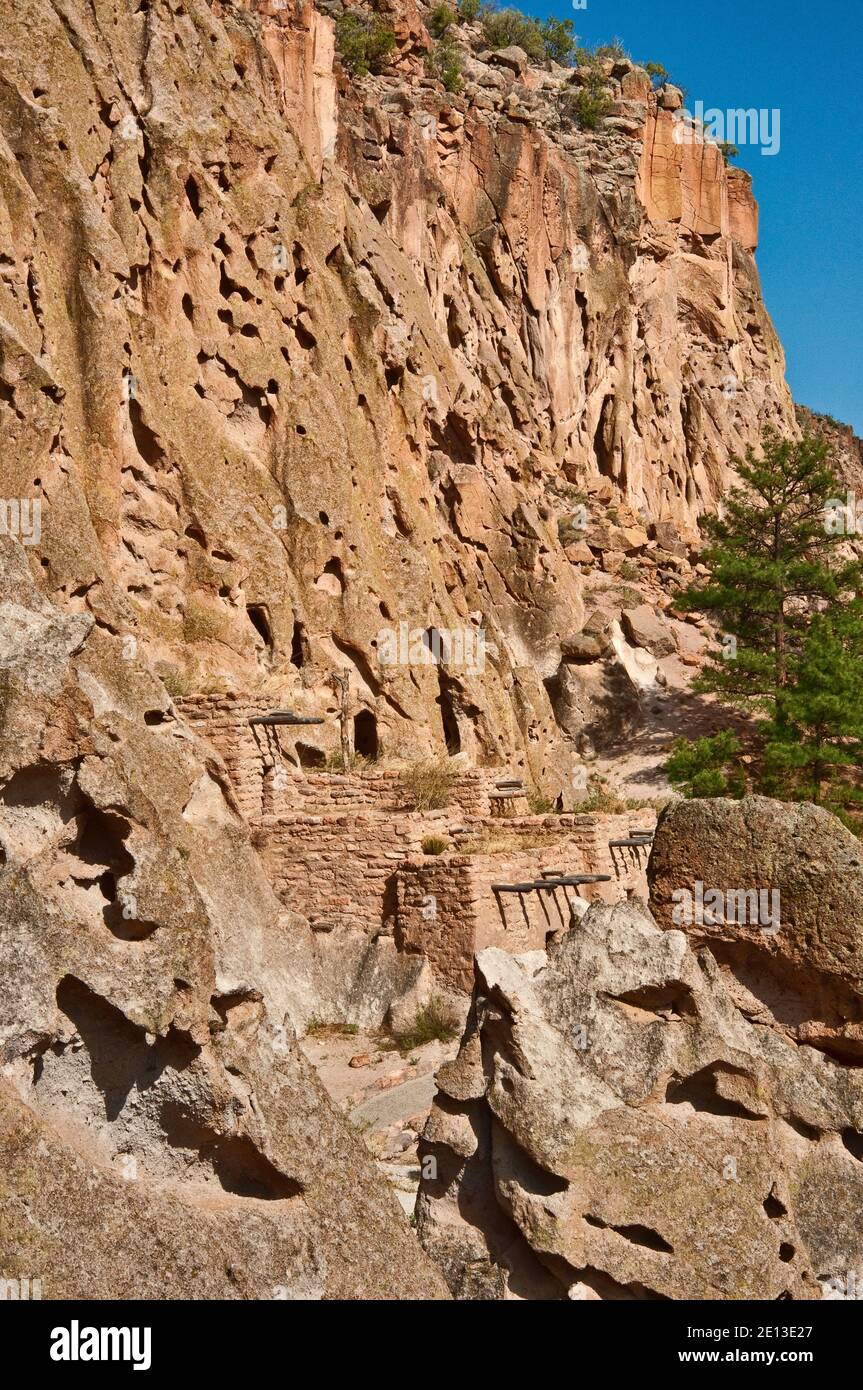 Reconstructed Talus House and cavates (cliff dwellings) built by Ancient Pueblo People in Frijoles Canyon, Bandelier Natl Monument, New Mexico, USA Stock Photo