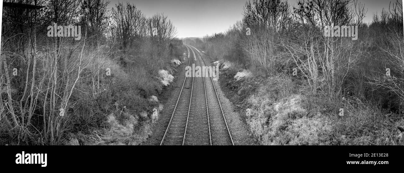 Twin rail track going off into the horizon. Stock Photo