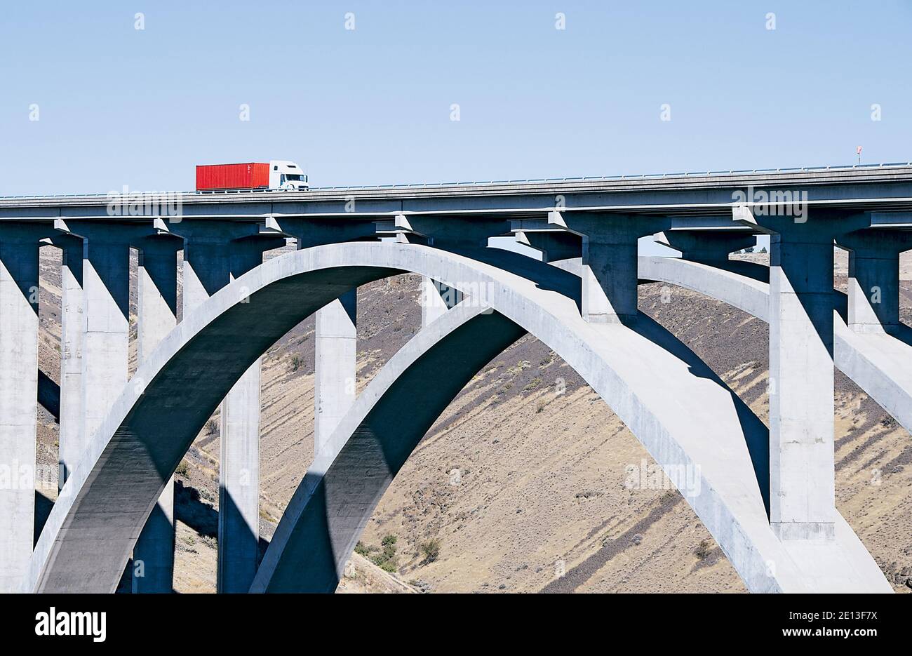 Truck Crossing Concrete Arch Bridge Stock Photo