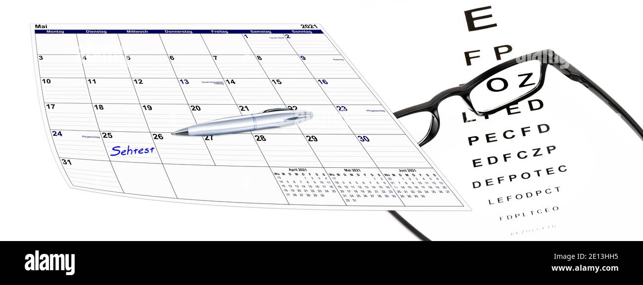 Kalender mit Sehtest und Brille und Kugelschreiber, Terminvergabe Stock Photo