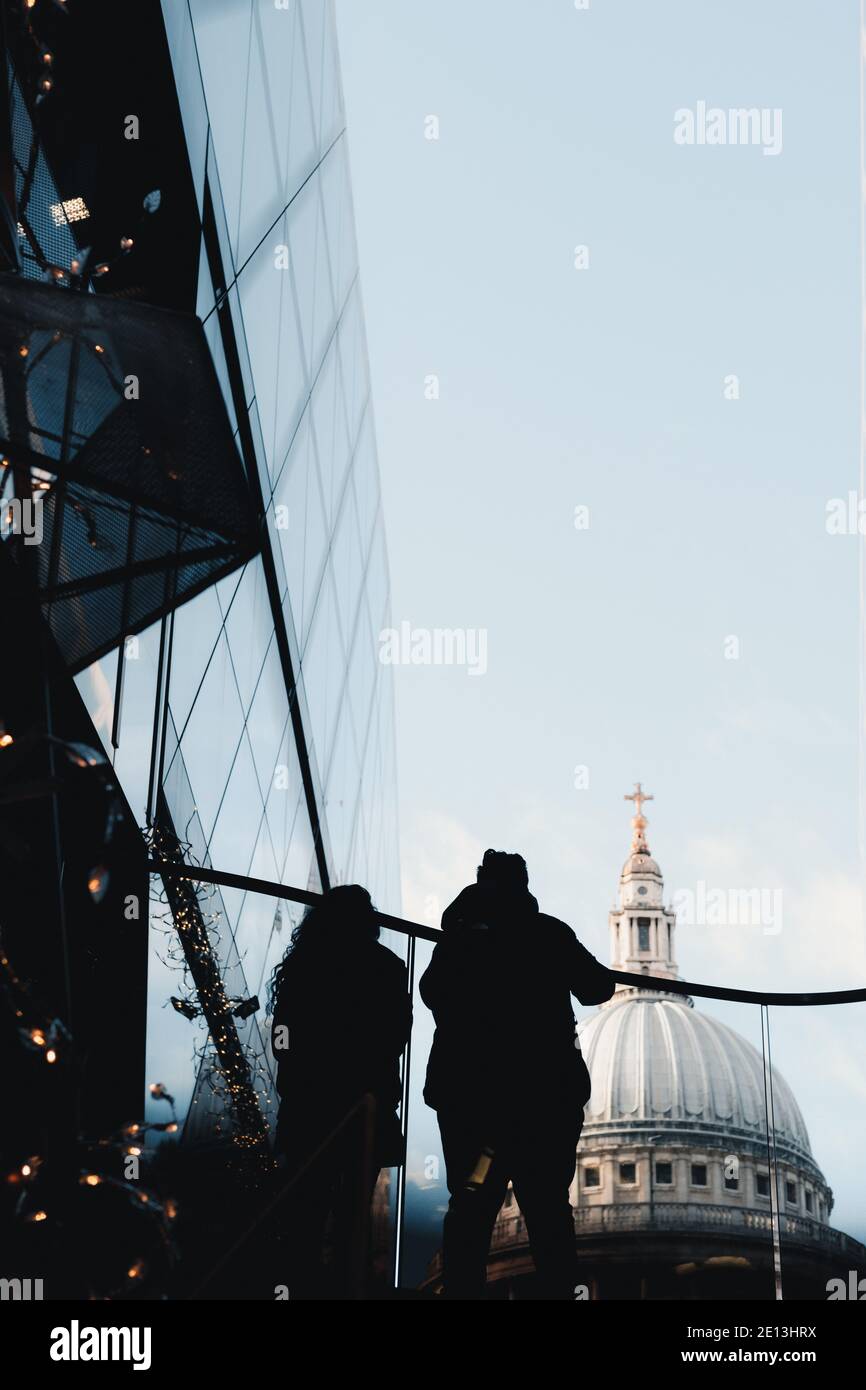 London, UK - January 2021 :   A couple looking towards the roof of St Paul's Cathedral Stock Photo