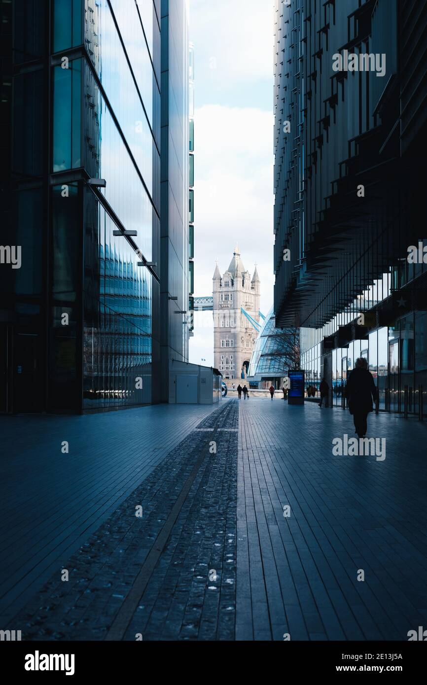 London, UK- January 2021. Modern office buildings of More London and pedestrian walkway looking towards Tower Bridge Stock Photo