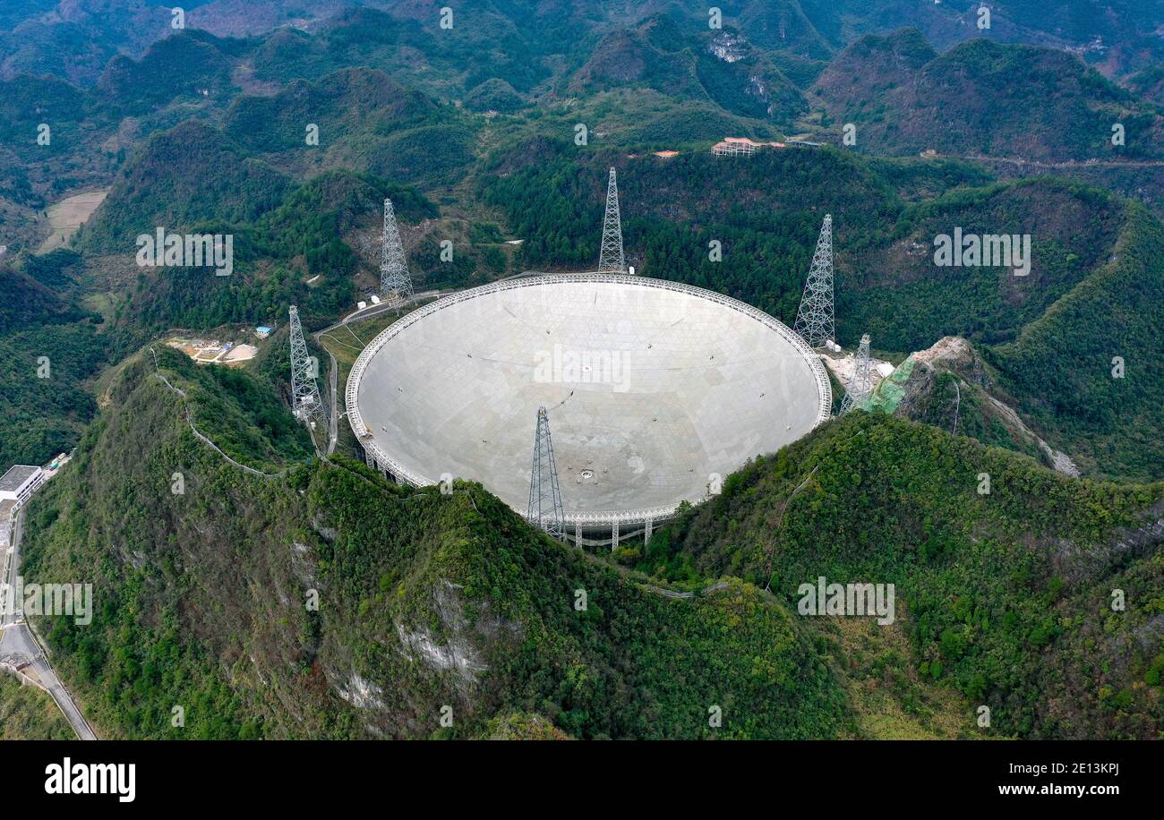 (210104) -- GUIYANG, Jan. 4, 2021 (Xinhua) -- Photo taken on Jan. 11, 2020 shows China's Five-hundred-meter Aperture Spherical Radio Telescope (FAST) under maintenance in southwest China's Guizhou Province. China's FAST, the world's largest single-dish radio telescope, will be available for global service from April 1. The National Astronomical Observatories of China (NAOC) of the Chinese Academy of Sciences, the operator of the telescope, confirmed Monday that scientists across the world can make online appointments for using the device for observation from April 1. An allotted timetable wi Stock Photo