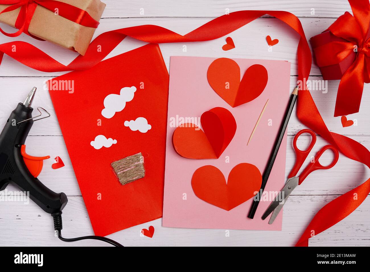 Valentines diy. Step by step instruction for handmade valentine greeting  card with parachute from hearts. Craft gift, flat lay. step 2 Stock Photo -  Alamy