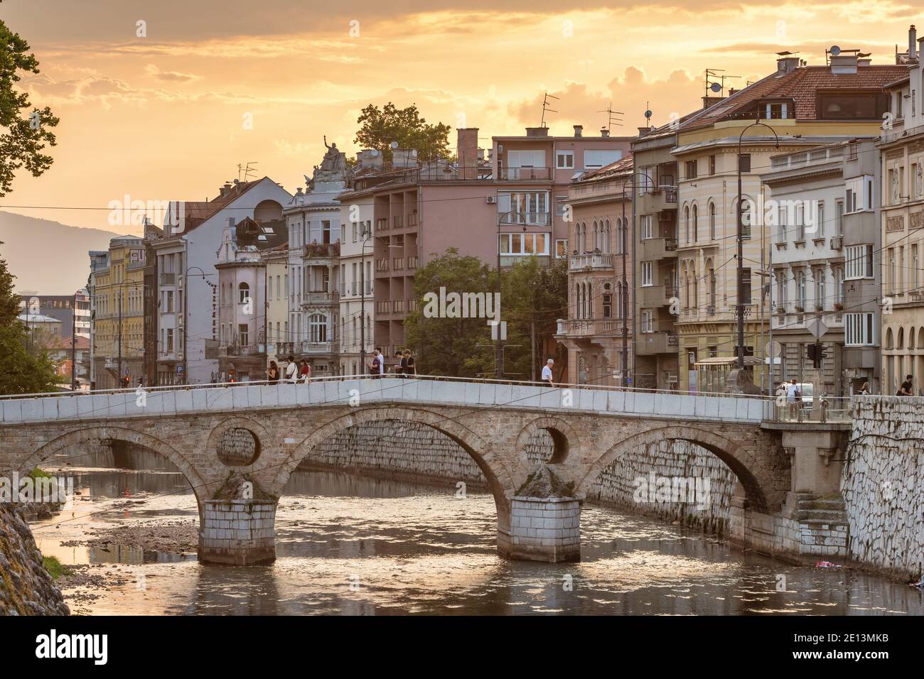 Latin Bridge on Miljacka River at sunset in Sarajevo, BIH Stock Photo