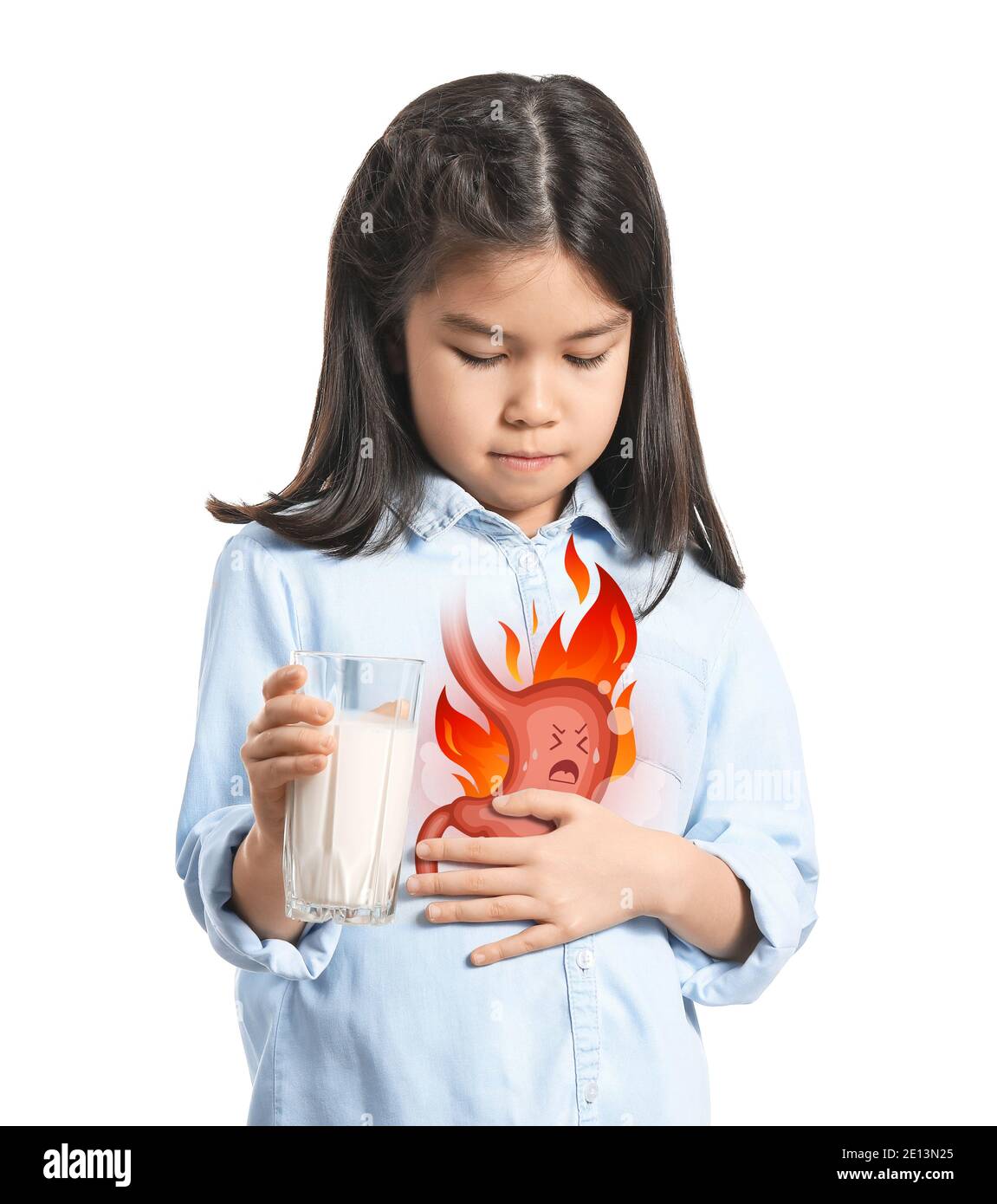 Little Asian girl drinking milk to relieve heartburn on white background Stock Photo