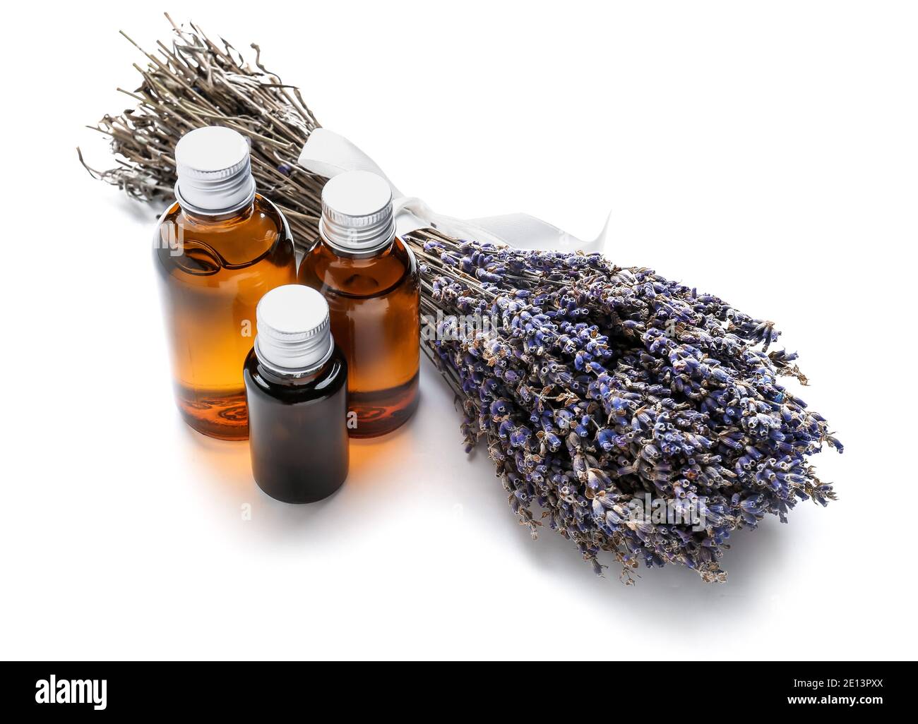 Bottles with lavender essential oil on white background Stock Photo - Alamy