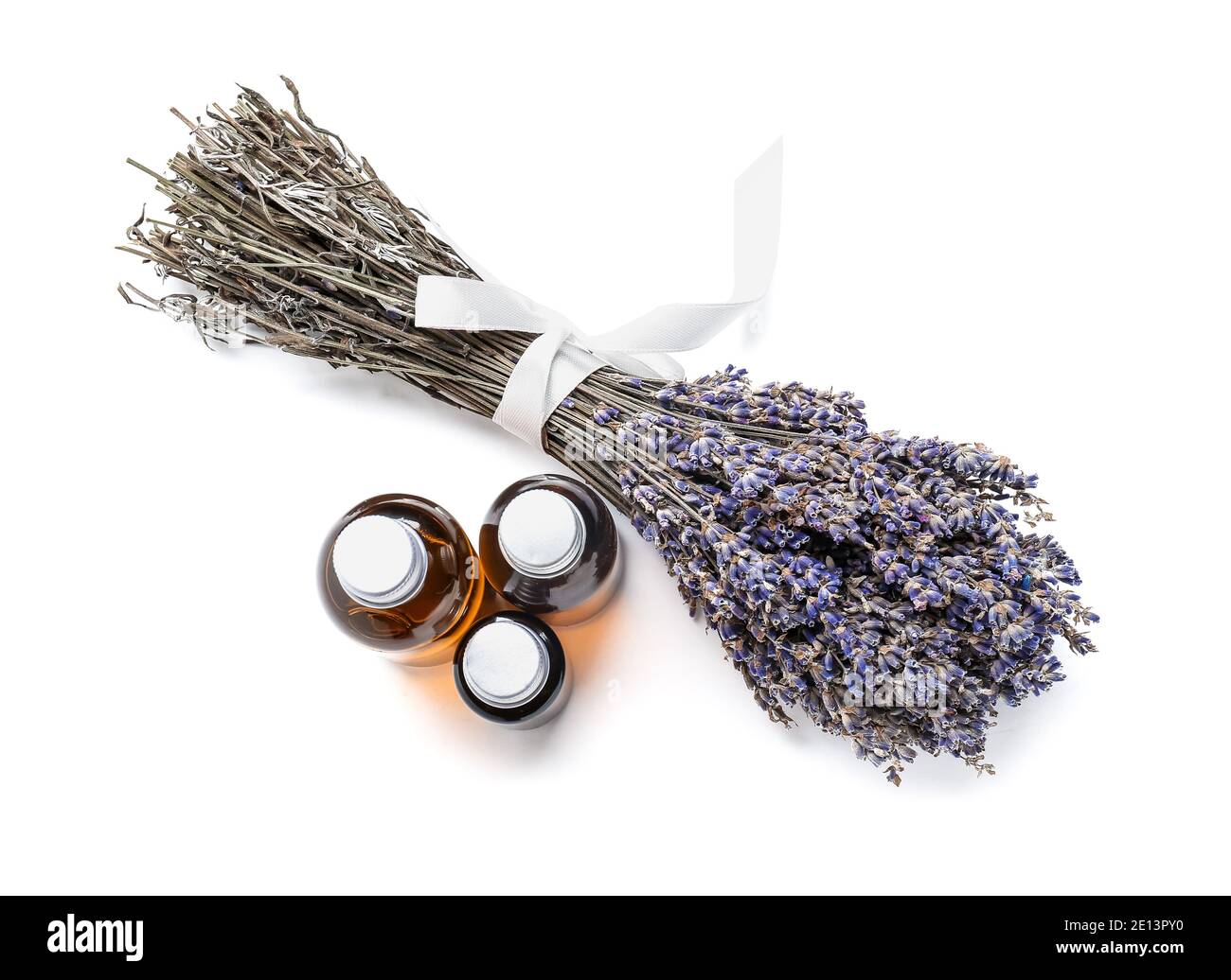 Bottles with lavender essential oil on white background Stock Photo - Alamy