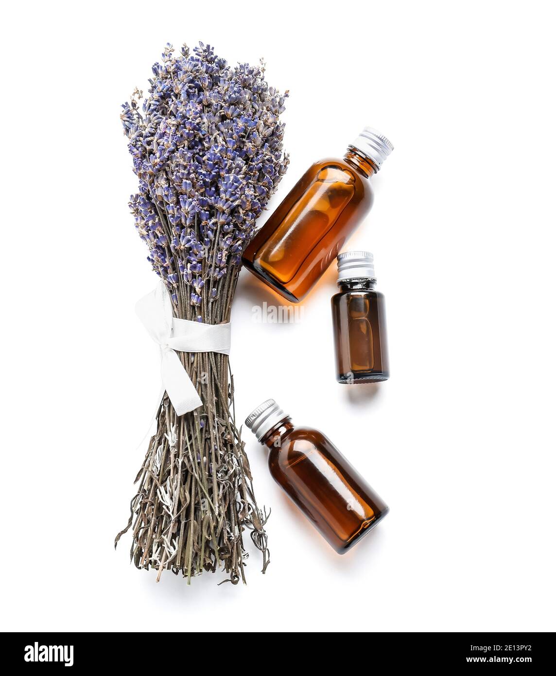 Bottles with lavender essential oil on white background Stock Photo - Alamy