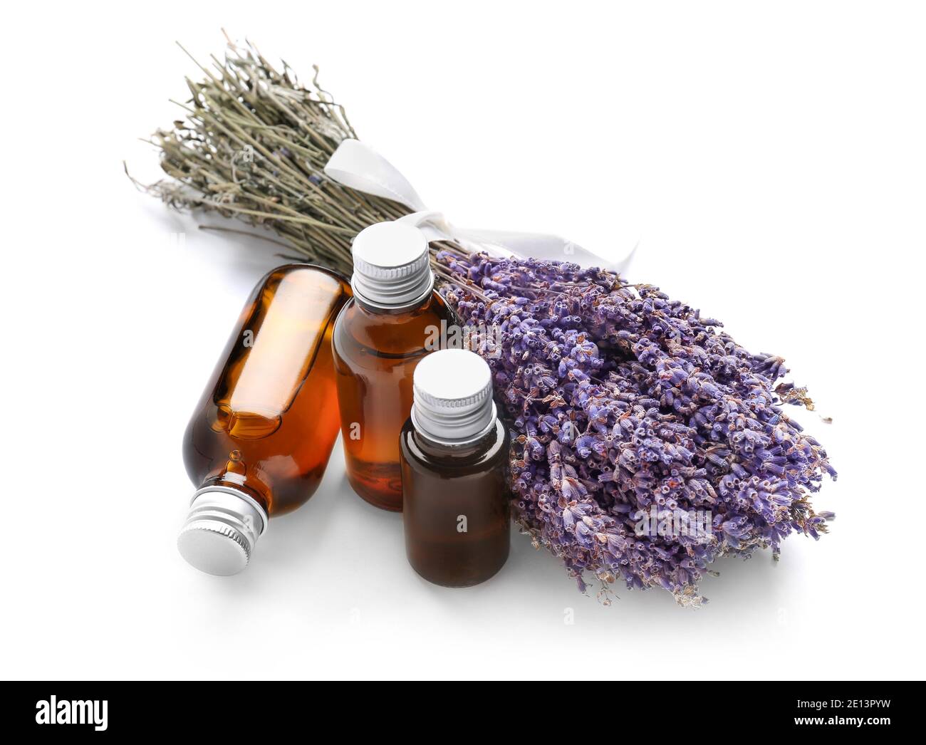 Bottles with lavender essential oil on white background Stock Photo - Alamy