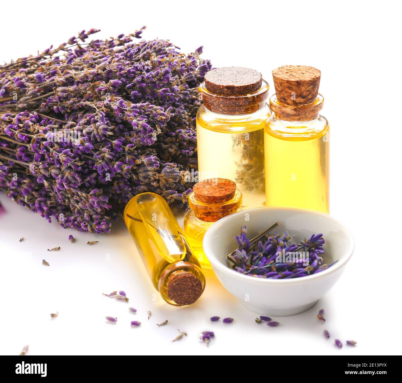 Bottles with lavender essential oil on white background Stock Photo - Alamy