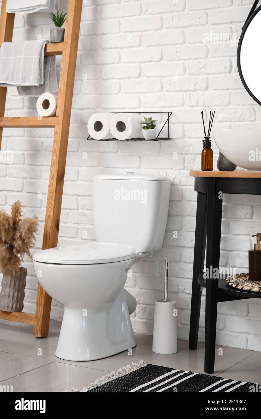 Modern toilet bowl in interior of stylish bathroom Stock Photo - Alamy