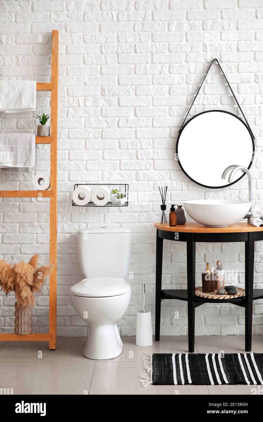 Modern toilet bowl in interior of stylish bathroom Stock Photo - Alamy