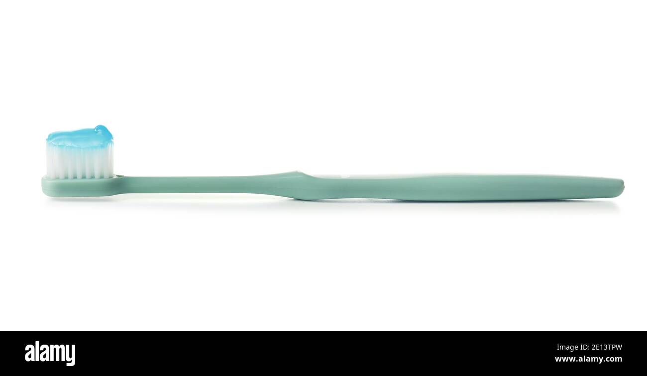 Toothbrush with paste on white background Stock Photo - Alamy