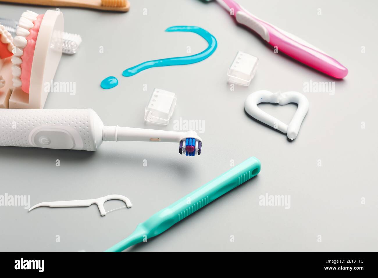 Set of oral hygiene and question mark on light background Stock Photo