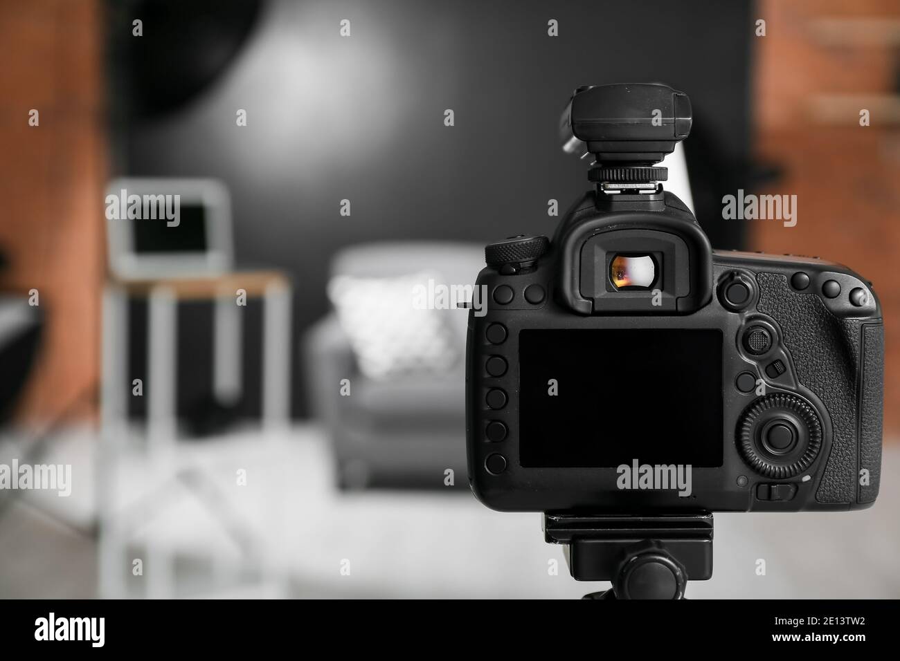 Professional camera on tripod in modern photo studio Stock Photo - Alamy