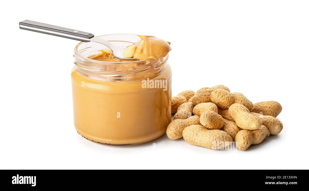 https://c8.alamy.com/comp/2E13XHN/jar-and-spoon-with-tasty-peanut-butter-on-white-background-2E13XHN.jpg