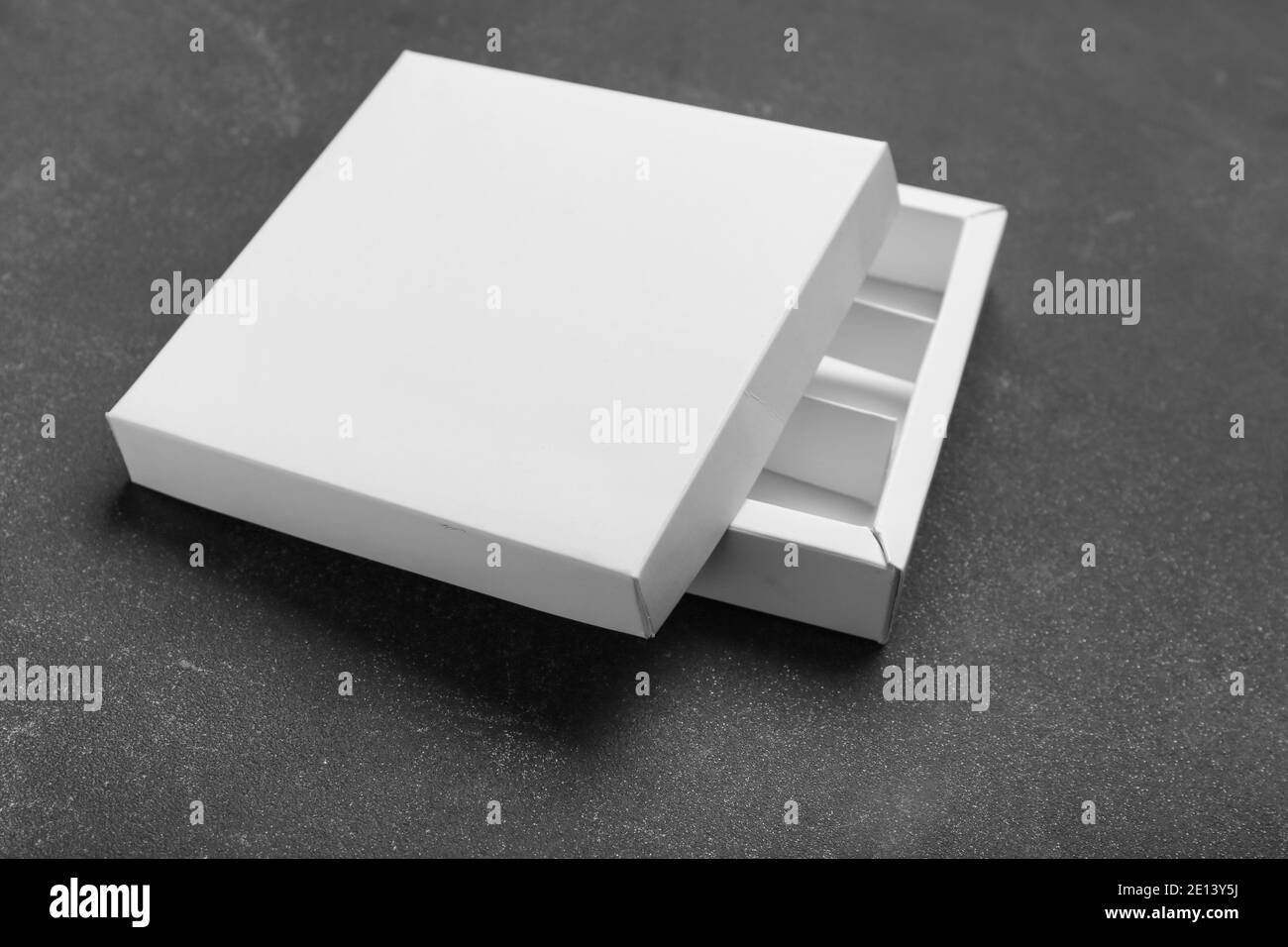 Blank cardboard box on dark background Stock Photo - Alamy