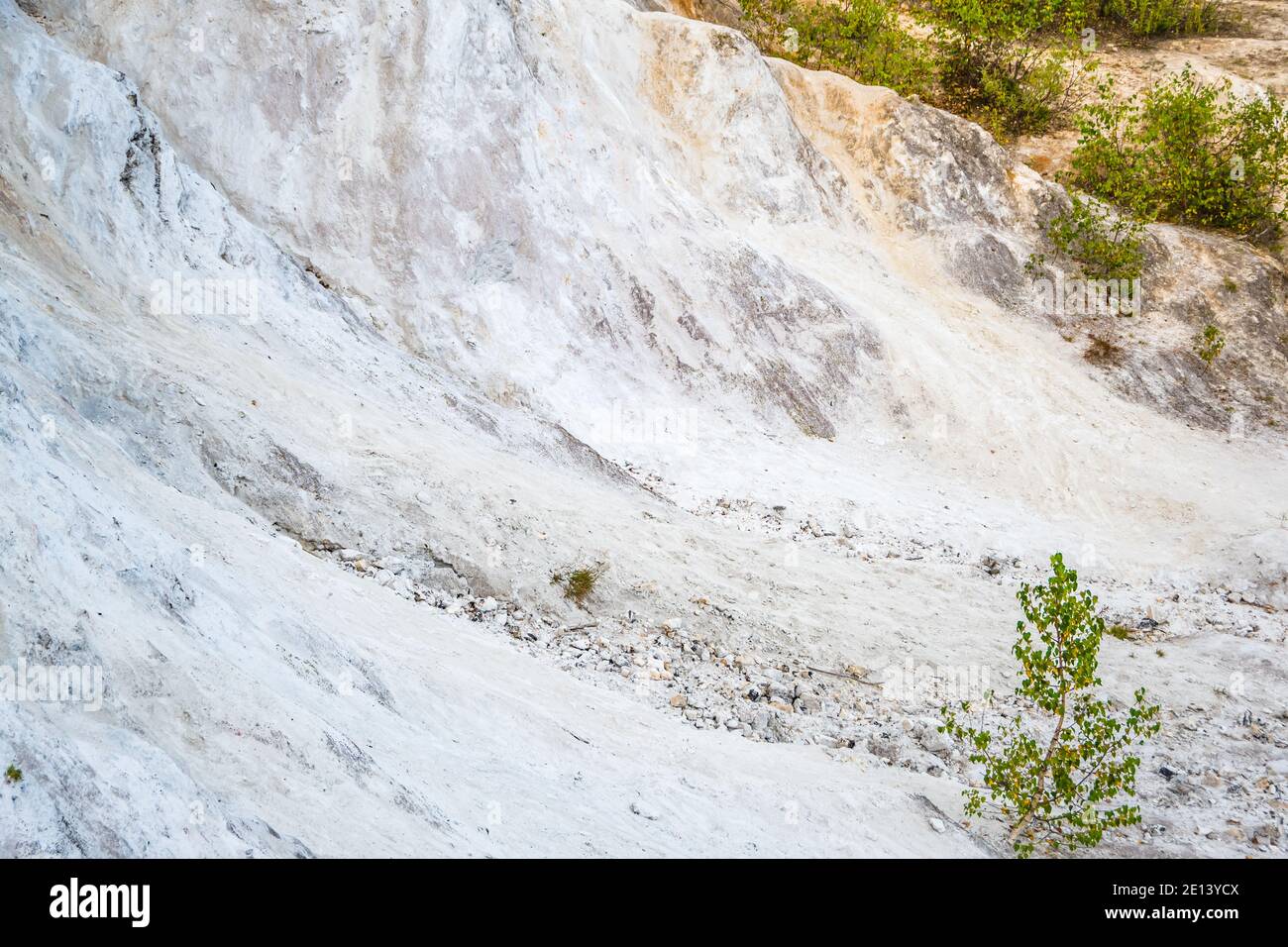 Talc Quarry Abandoned talc quarry overgrown with trees and grass Stock Photo - Alamy
