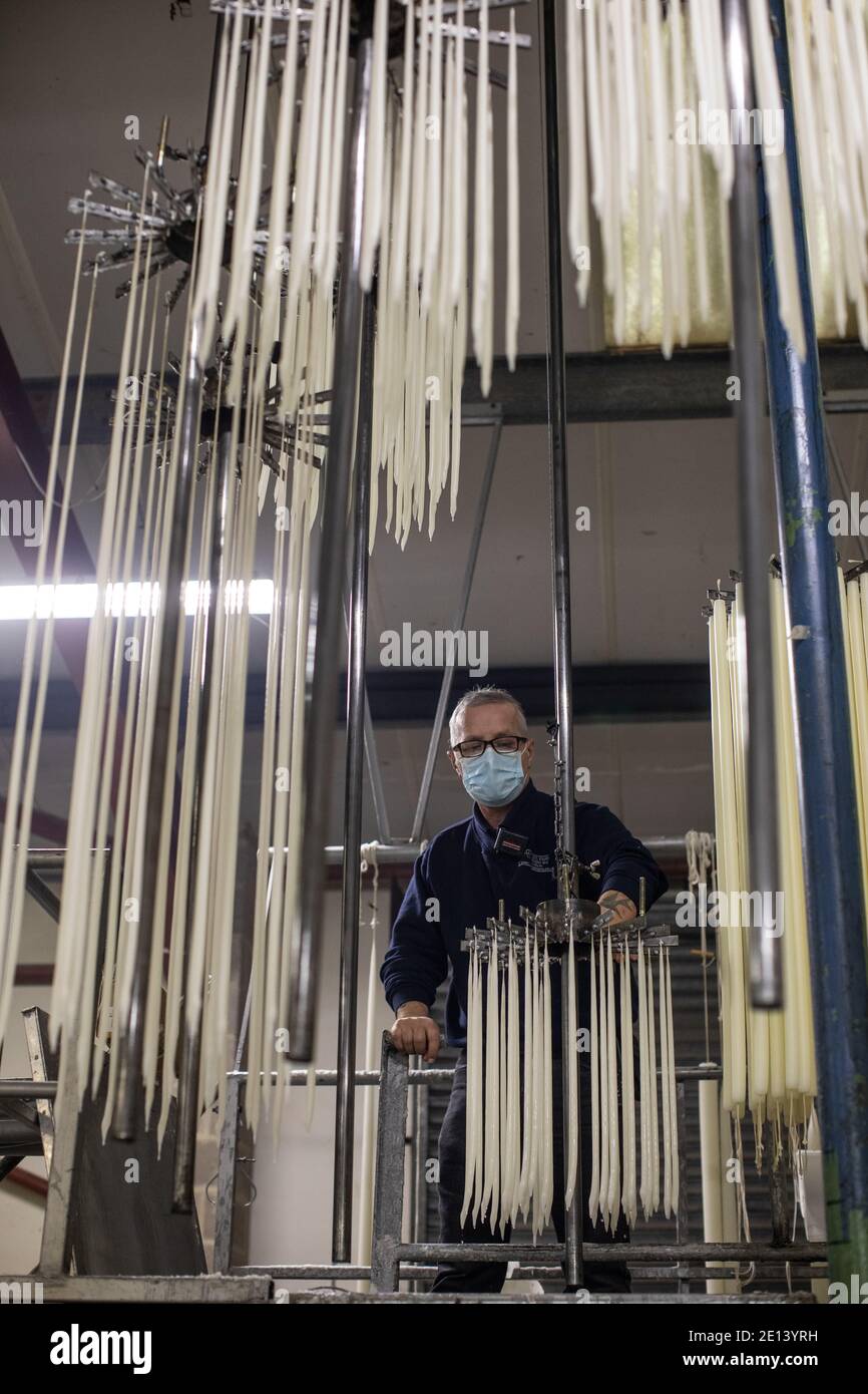 Hand dipping candles process called ‘casting’ where the candle is repeatedly dipped in wax