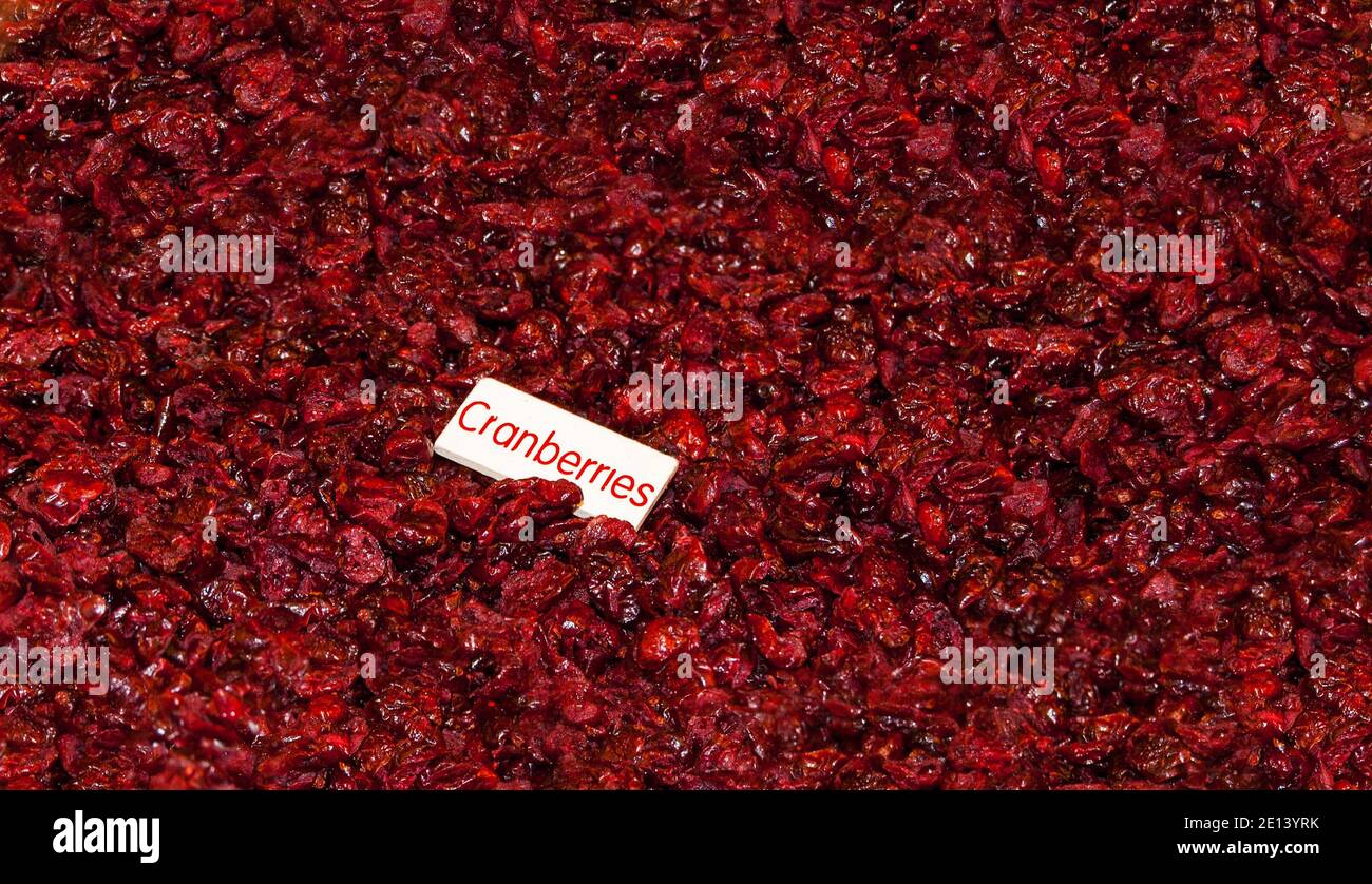 Dried cranberries background with label Stock Photo Alamy