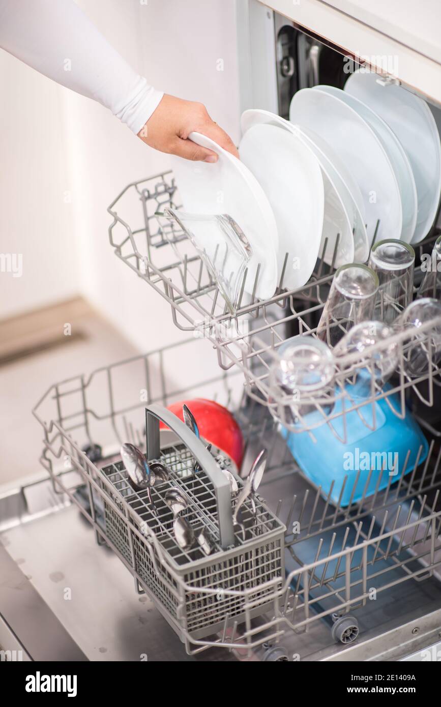 Open dishwasher with clean glass and dishes Stock Photo Alamy