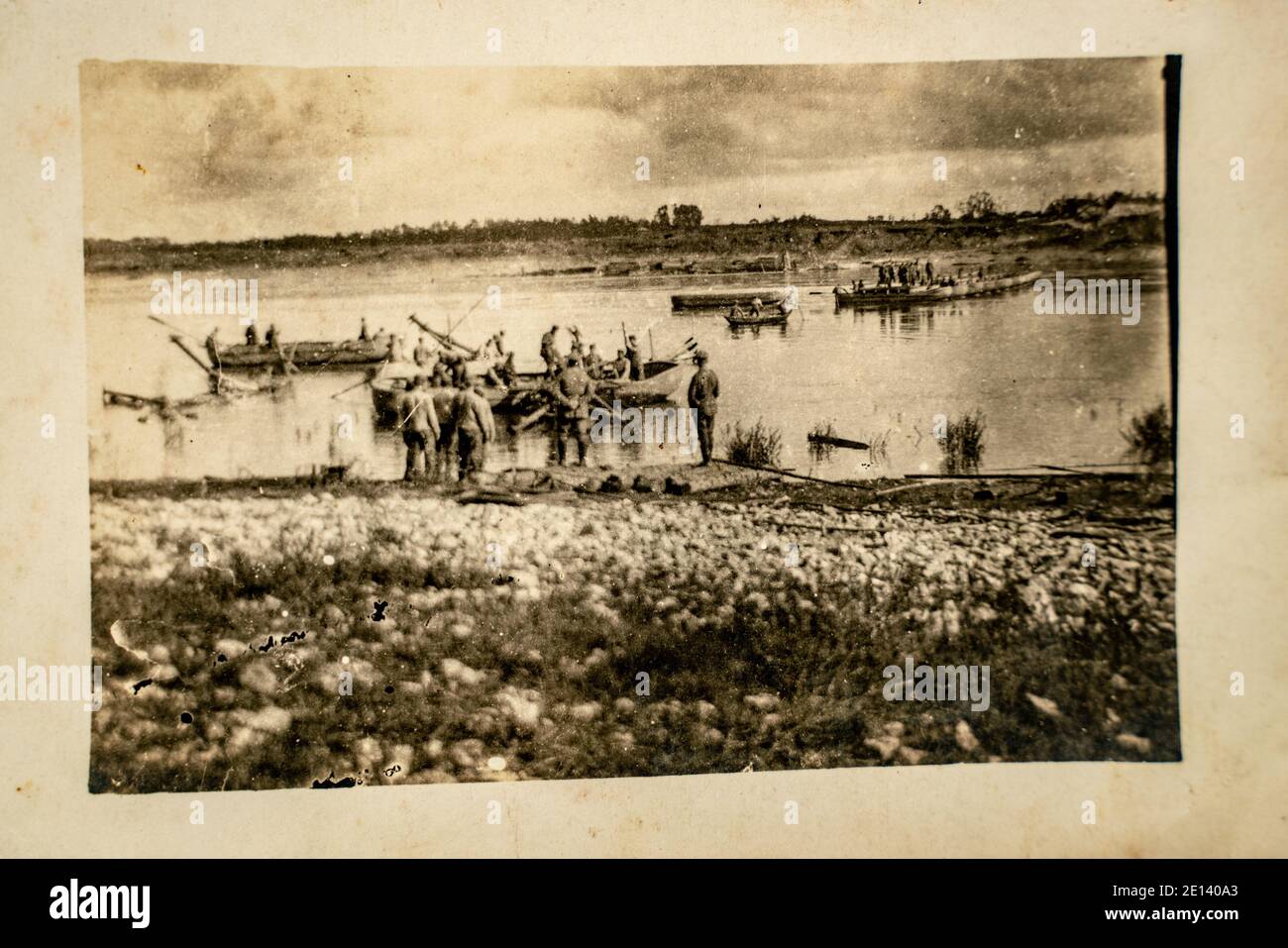 Latvia - CIRCA 1918: Latvian army troops crossing the river at World War I. Archive vintage black and white battlefield photography Stock Photo