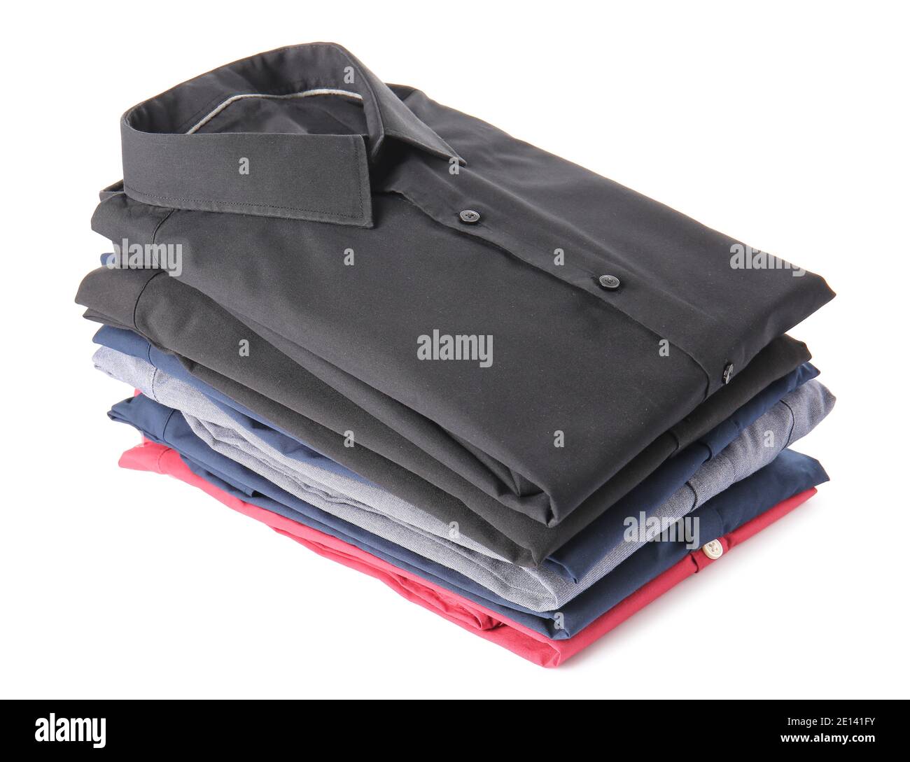 Stack of folded male shirts on white background Stock Photo - Alamy