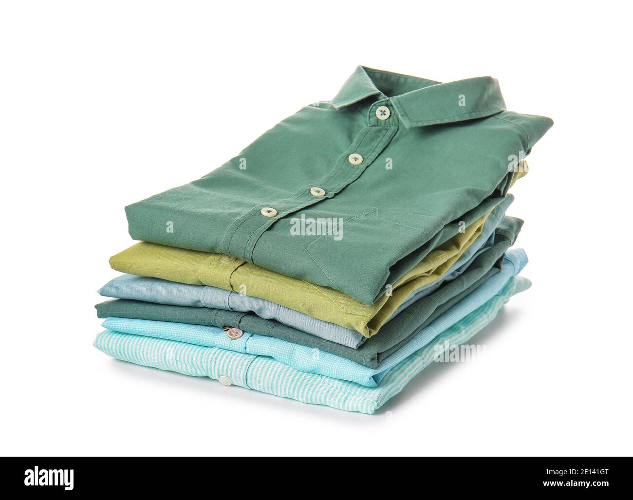 Stack of folded male shirts on white background Stock Photo - Alamy