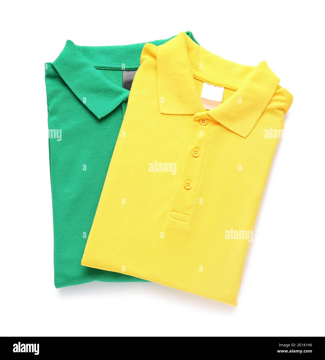 Folded polo shirts on white background Stock Photo - Alamy