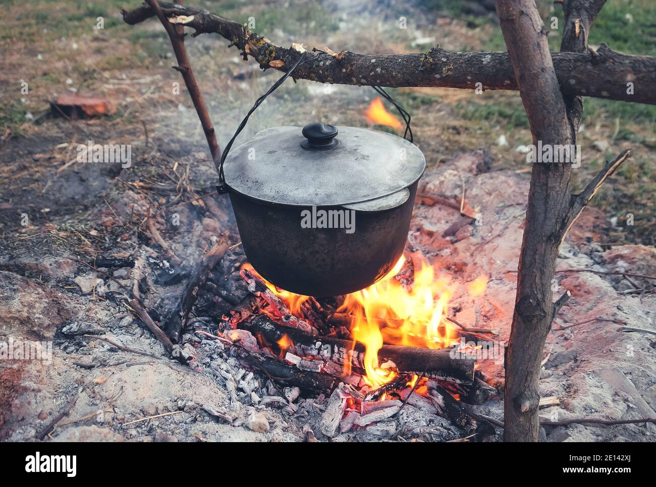 Cauldron for preparation food on fire outdoors Stock Photo Alamy