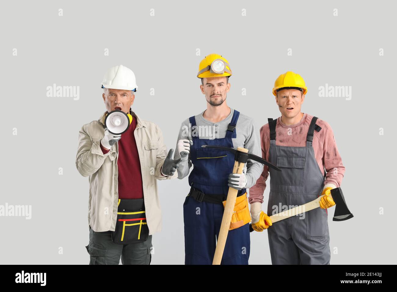 Protesting miner men on grey background Stock Photo