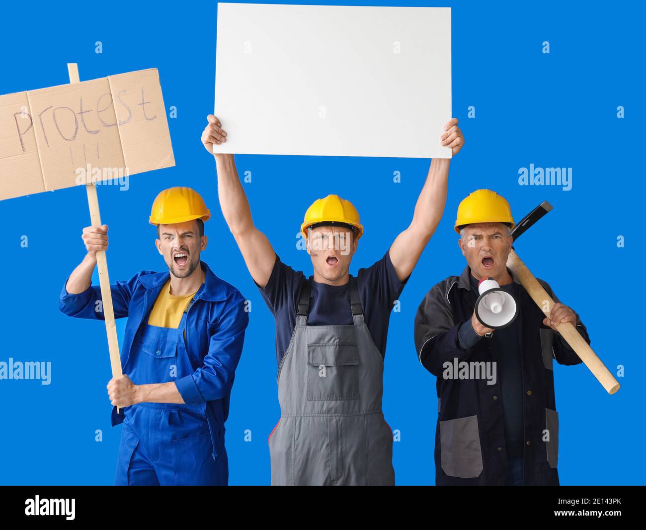 Protesting miner men with placards on color background Stock Photo