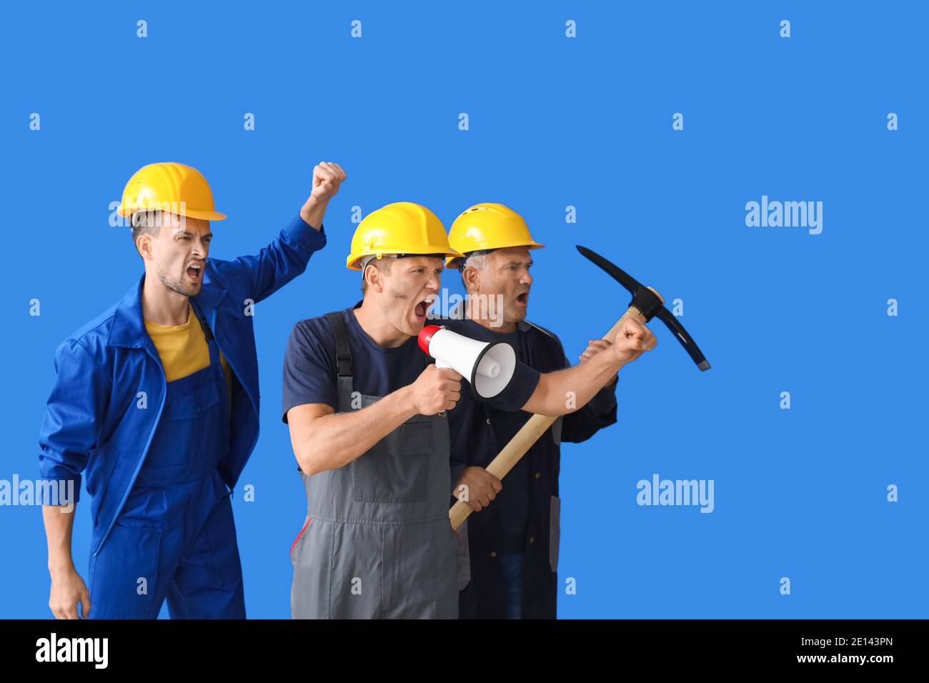 Protesting miner men on color background Stock Photo