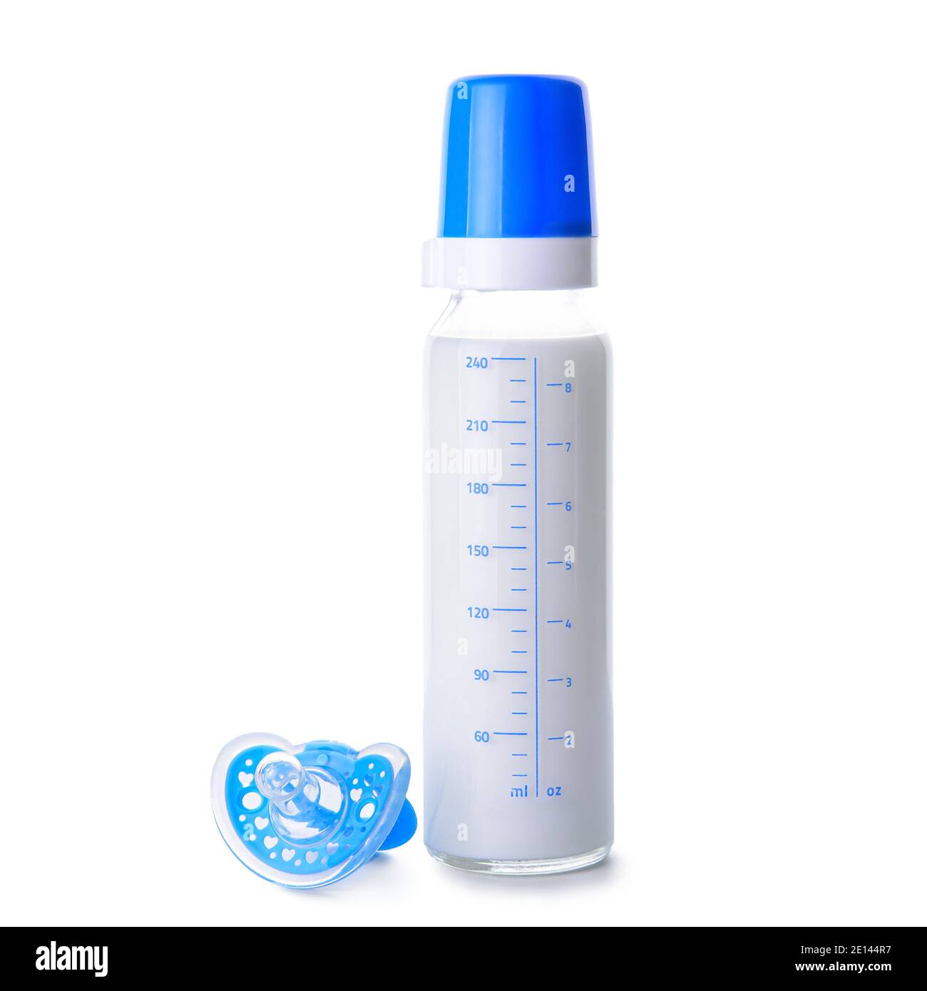 Bottle of milk for baby and pacifier on white background Stock Photo