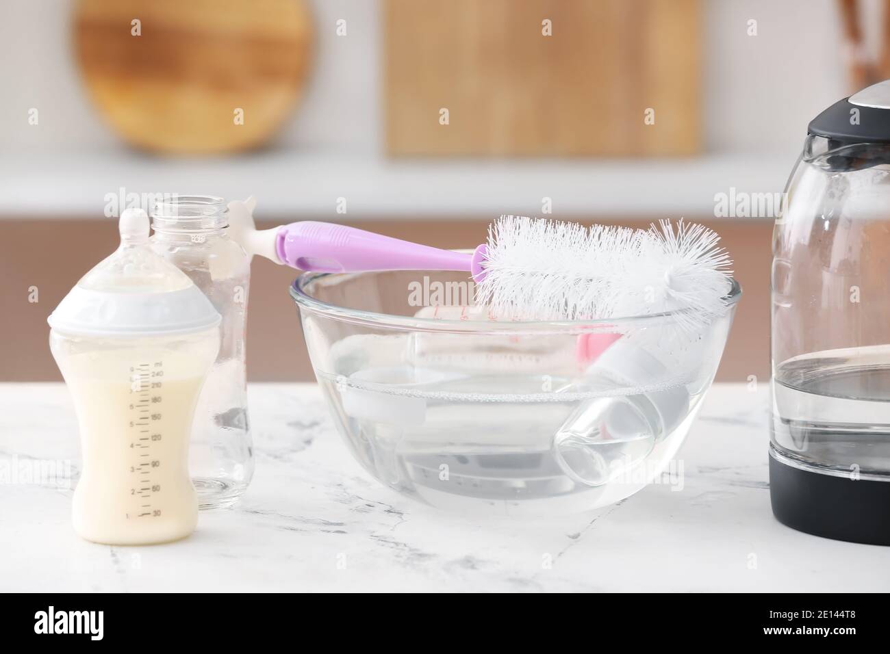 Cleaning of baby bottles at home Stock Photo Alamy