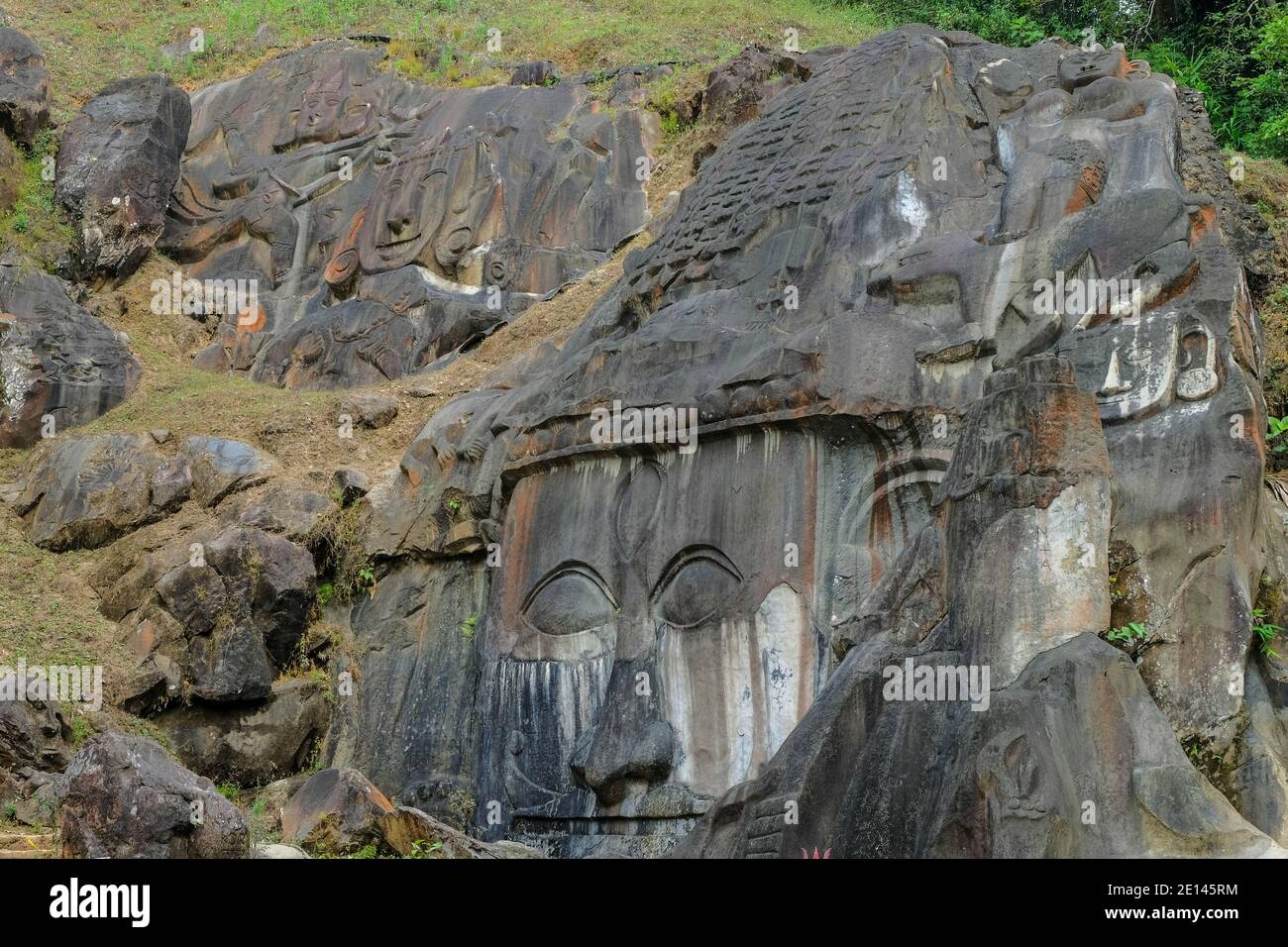 Sculptures carved into the rock at the archaeological site of Unakoti in the state of Tripura. India. Stock Photo